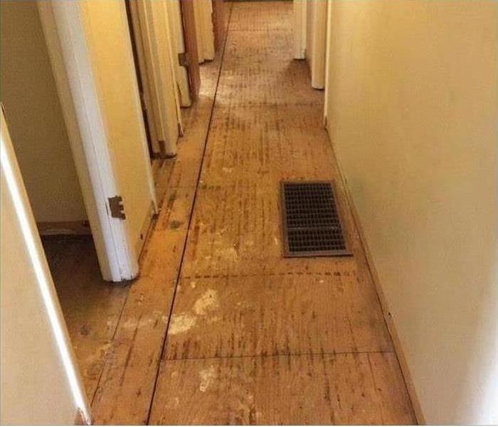 hallway with flooring removed