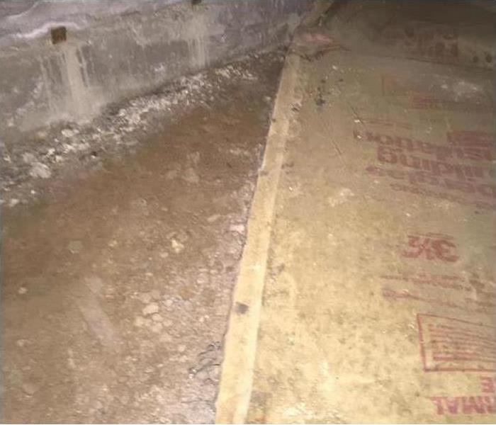 crawlspace cleaned up with lime spread on ground