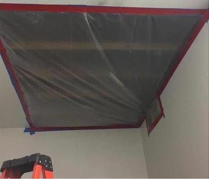 containment plastic covering hole on ceiling