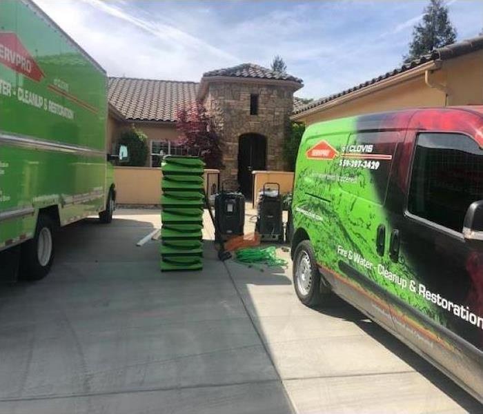 picture of SERVPRO trucks in front of home